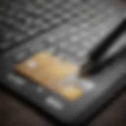 A close-up view of a credit card application form with a pen and calculator.