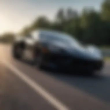 Sleek black sports car on open road